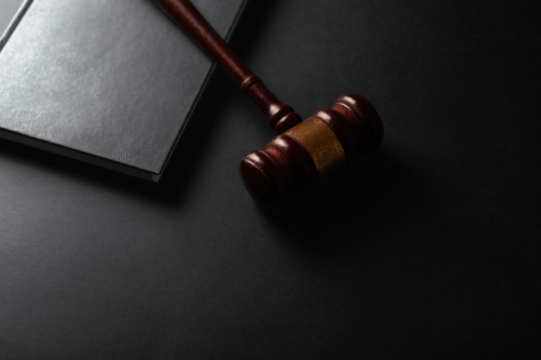 Judge gavel and book on black background. Law and justice concept